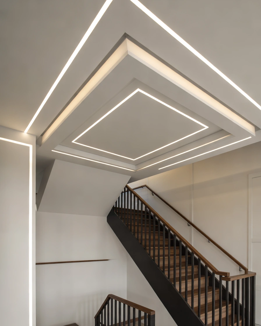 Geometric Pattern Ceiling Above the Stairs