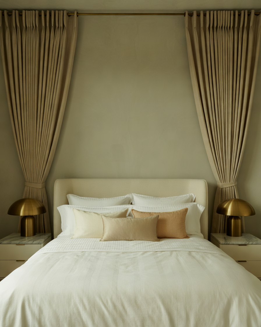 Pleated-Blackout-Curtains-with-Brass-Hardware-for-a-Timeless-Elegant-Bedroom